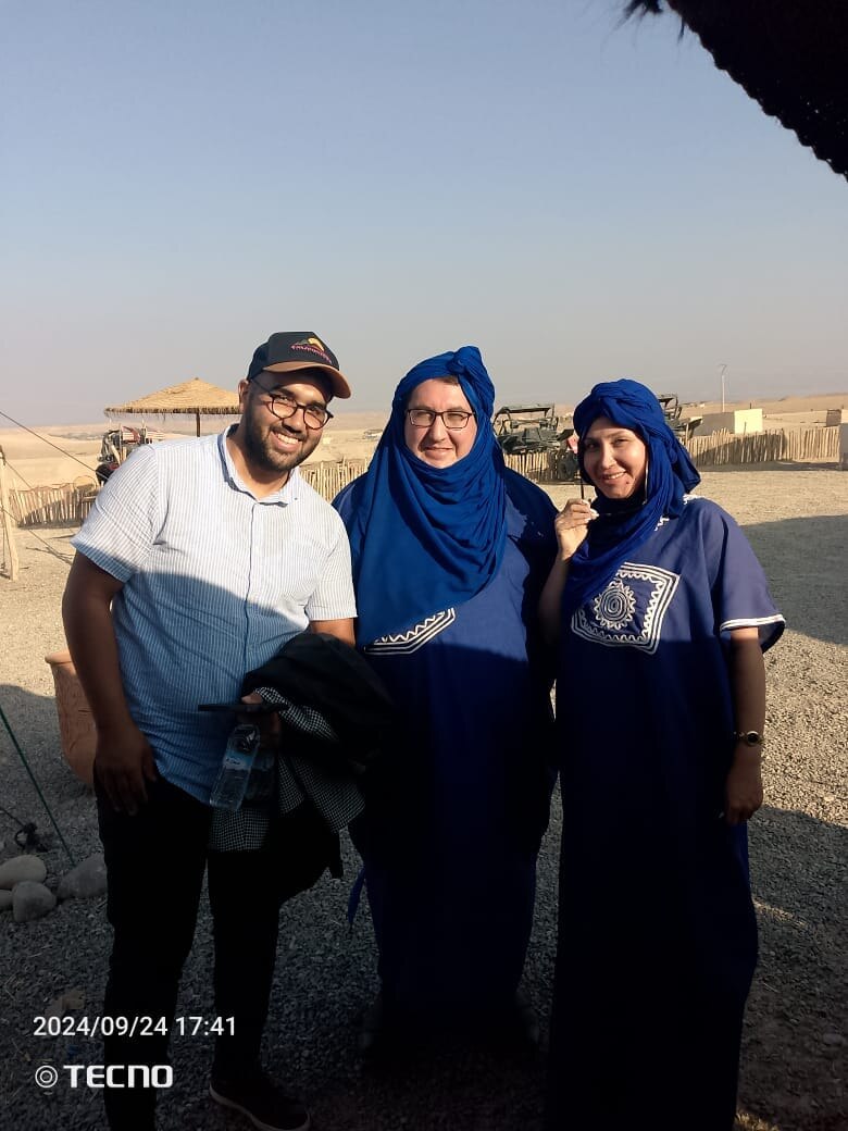 Ayoub welcoming guests to a desert experience